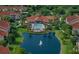 Community pool and pond with lush landscaping at 4178 Central Sarasota Pkwy # 316, Sarasota, FL 34238