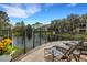 Community patio with lounge chairs and a pond view at 4178 Central Sarasota Pkwy # 316, Sarasota, FL 34238