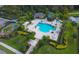 Aerial view of community pool, playground, and landscaping at 6432 Autumn Woods Way, Sarasota, FL 34243