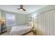 Cozy bedroom with a full-size bed and double door closet at 6432 Autumn Woods Way, Sarasota, FL 34243