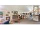 Bright studio space featuring artwork, comfortable seating, and storage at 2525 Ashton Rd, Sarasota, FL 34231