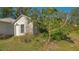 Small white shed nestled in the backyard at 2525 Ashton Rd, Sarasota, FL 34231