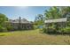 Large backyard, featuring a secondary structure and lush greenery at 2525 Ashton Rd, Sarasota, FL 34231