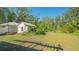 Secondary building and large backyard with mature trees at 2525 Ashton Rd, Sarasota, FL 34231