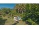 Backyard with seating area under the shade of trees at 2525 Ashton Rd, Sarasota, FL 34231