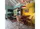Small dining area with rustic wooden table and chairs at 2525 Ashton Rd, Sarasota, FL 34231