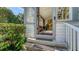 Sunlit entryway with tiled floor, featuring a unique painted screen at 2525 Ashton Rd, Sarasota, FL 34231