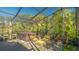 Relaxing screened-in patio with hot tub and seating at 2525 Ashton Rd, Sarasota, FL 34231