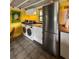 Bright kitchen with stainless steel appliances and washer/dryer at 2525 Ashton Rd, Sarasota, FL 34231