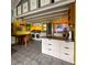 Open concept kitchen features a dining area and modern cabinetry at 2525 Ashton Rd, Sarasota, FL 34231