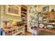 Kitchen boasts unique storage solutions, a brick accent wall, and open shelving at 2525 Ashton Rd, Sarasota, FL 34231