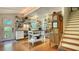 Well-equipped kitchen with white cabinets, cork flooring, and open shelving at 2525 Ashton Rd, Sarasota, FL 34231