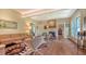 Spacious living area with hardwood floors, a fireplace, and ample natural light at 2525 Ashton Rd, Sarasota, FL 34231