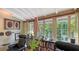 Office with hardwood floors, large windows, and built-in shelving at 2525 Ashton Rd, Sarasota, FL 34231