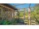 Enclosed outdoor shower area with lush tropical landscaping at 2525 Ashton Rd, Sarasota, FL 34231