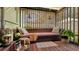 Relaxing patio space with daybed and lush greenery at 2525 Ashton Rd, Sarasota, FL 34231