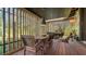 Covered patio with seating area and wooden floors at 2525 Ashton Rd, Sarasota, FL 34231