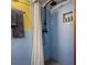 Modern shower with black fixtures and a striped shower curtain at 2525 Ashton Rd, Sarasota, FL 34231