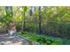 Outdoor oasis featuring a tranquil water feature and greenery at 2525 Ashton Rd, Sarasota, FL 34231