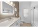 Updated bathroom with a large vanity, soaking tub, and glass shower at 5755 Carriage Dr, Sarasota, FL 34243