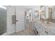Bright bathroom with double vanity and access to shower at 5755 Carriage Dr, Sarasota, FL 34243