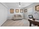 Spacious bedroom with a loveseat, desk, and large window at 5755 Carriage Dr, Sarasota, FL 34243