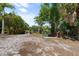 Private canal access with wooden dock at 5755 Carriage Dr, Sarasota, FL 34243