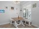 Charming breakfast nook with built-in bench seating and a wood table at 5755 Carriage Dr, Sarasota, FL 34243