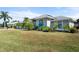 House with gray exterior and lush landscaping at 5755 Carriage Dr, Sarasota, FL 34243