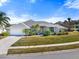 One-story home with a white garage door at 5755 Carriage Dr, Sarasota, FL 34243