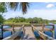 Community fishing dock on a tranquil waterway at 5755 Carriage Dr, Sarasota, FL 34243