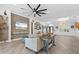 Open living space with a view of the kitchen and entryway at 5755 Carriage Dr, Sarasota, FL 34243