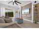 Living area with a large TV and comfortable seating at 5755 Carriage Dr, Sarasota, FL 34243