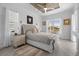 Bright main bedroom with water views and tray ceiling at 5755 Carriage Dr, Sarasota, FL 34243
