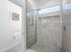 Large walk-in shower with marble tile and glass enclosure at 5755 Carriage Dr, Sarasota, FL 34243