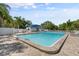 Community swimming pool with lounge chairs at 5755 Carriage Dr, Sarasota, FL 34243