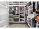 Spacious walk-in closet with ample shelving and hanging space at 5755 Carriage Dr, Sarasota, FL 34243