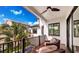 Covered balcony with seating area and view of the backyard at 6506 Gulf Dr, Holmes Beach, FL 34217