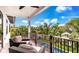 Relaxing balcony overlooking the pool and lush tropical landscape at 6506 Gulf Dr, Holmes Beach, FL 34217