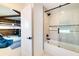 Bathroom with tub and shower, adjacent to bedroom at 6506 Gulf Dr, Holmes Beach, FL 34217