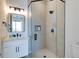 Clean bathroom with a walk-in shower and modern vanity at 6506 Gulf Dr, Holmes Beach, FL 34217