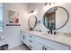 Modern bathroom with double vanity, large mirror, and walk-in shower at 6506 Gulf Dr, Holmes Beach, FL 34217