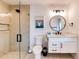 Modern bathroom with walk-in shower and floating vanity at 6506 Gulf Dr, Holmes Beach, FL 34217