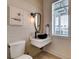 Modern bathroom with floating vanity and black sink at 6506 Gulf Dr, Holmes Beach, FL 34217