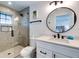 Clean bathroom with a walk-in shower and white vanity at 6506 Gulf Dr, Holmes Beach, FL 34217