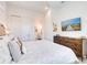 Main bedroom with ensuite bathroom and large TV at 6506 Gulf Dr, Holmes Beach, FL 34217