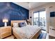 Bright bedroom with a king-size bed and access to a balcony at 6506 Gulf Dr, Holmes Beach, FL 34217