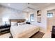 Main bedroom with a king bed and decorative wall at 6506 Gulf Dr, Holmes Beach, FL 34217