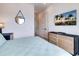 Bedroom with ensuite bathroom and large TV at 6506 Gulf Dr, Holmes Beach, FL 34217