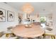 Bright dining room with round table and view of the kitchen at 6506 Gulf Dr, Holmes Beach, FL 34217